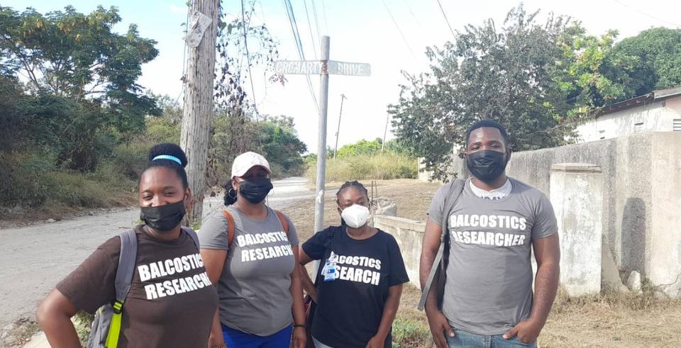 Four Balcostics Research interviewers at a rural junction during fieldwork